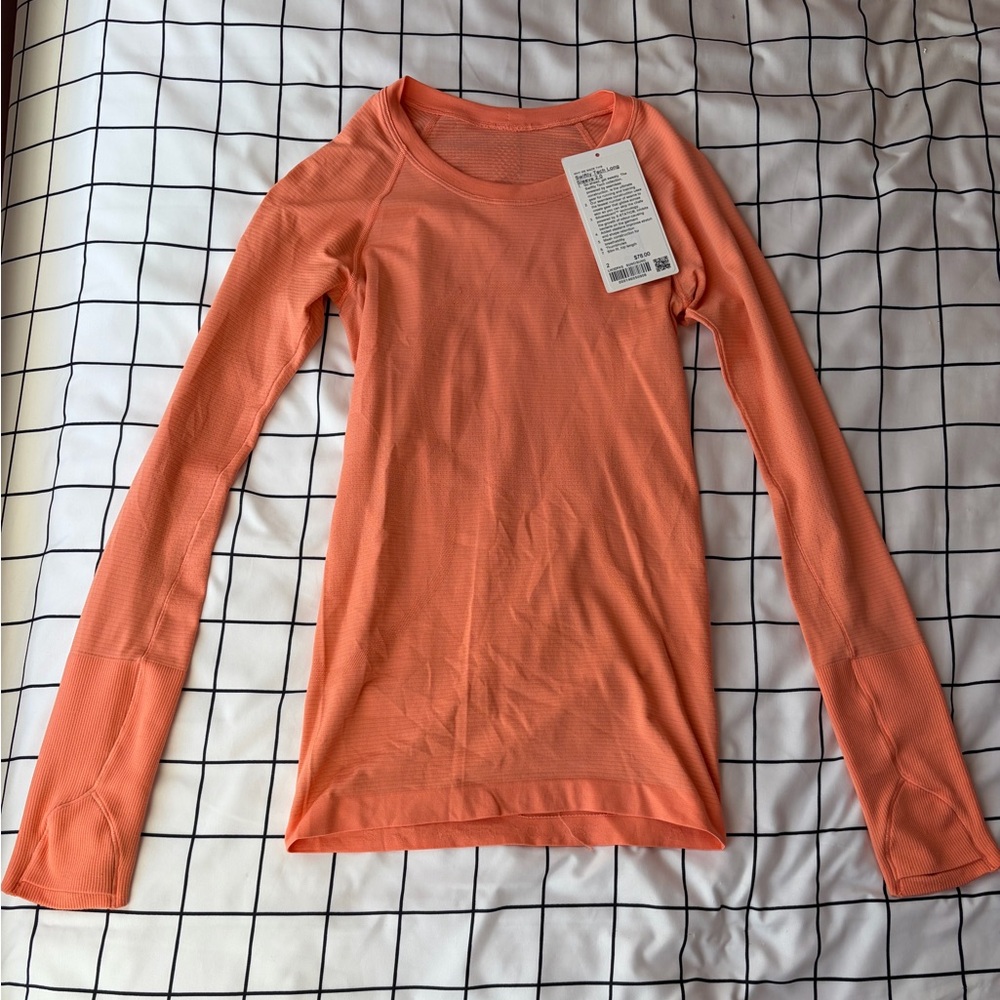 Lululemon Woman’s Coral Long Sleeve Swiftly Tech, Size 2, Hip Length. NWT.